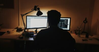 man using computer inside room