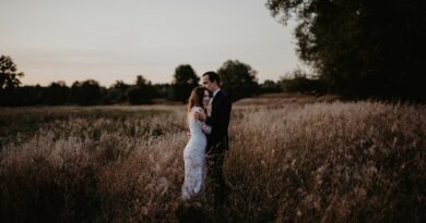 man and woman standing on grass